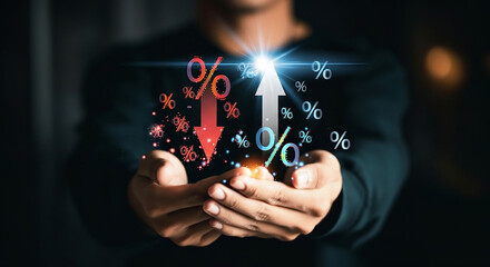 Person holding percentage symbols with up and down arrows, representing financial rates.