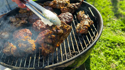 Sizzling barbecue symphony, ancestral smoke whispers, backyard feast, tongs orchestrate, multicultural unity, Labor Day, Midsummer celebration