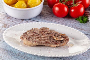 Grilled lamb steak with bone