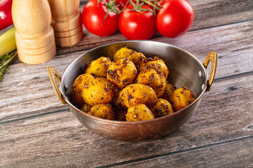Baked small baby potato with herbs