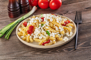 Italian pasta fusili with curd