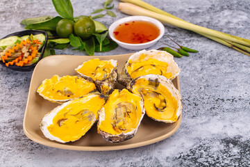Baked oyster with cheddar cheese