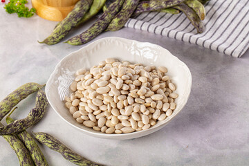 Naklejka premium Raw dry white beans heap