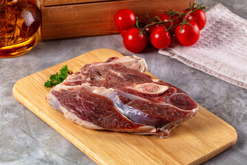 Raw lamb steak with bone