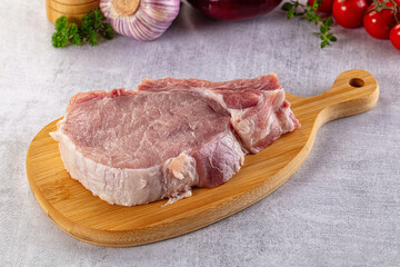 Raw pork steak with bone