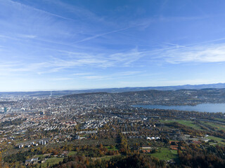 Aerial view of beautiful Swiss autumn landscape with city of Zürich seen from local mountain Uetliberg on a sunny autumn day. Photo taken October 29th, 2025, Zurich Uetliberg, Switzerland.