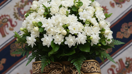 Exclusive bouquet made of Javanese jasmine flowers with green leaf accents
