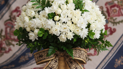 Exclusive bouquet made of Javanese jasmine flowers with green leaf accents