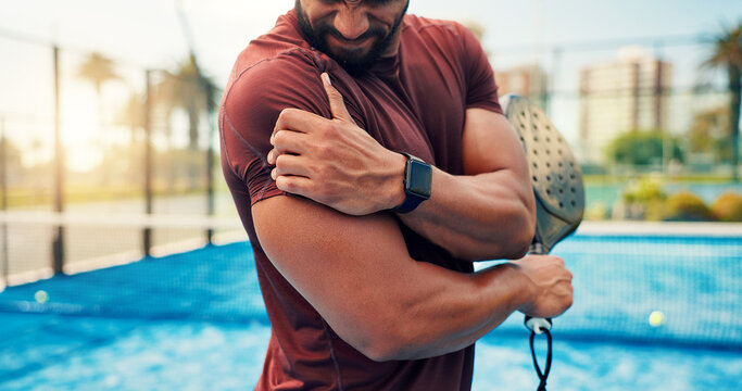 Athlete, man and shoulder pain on padel court from fitness, match accident and muscle sprain. Person, discomfort and joint strain with exercise mistake, inflammation and tennis injury from tournament