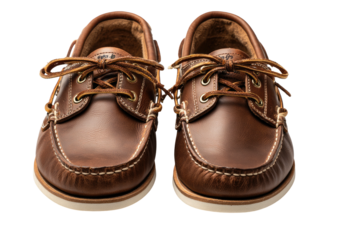 Brown leather boat shoes, laces tied, eye-level, simple shot