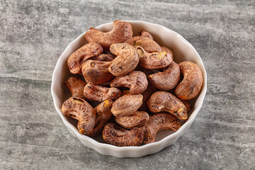 Unpeeled cashew nuts in the bowl