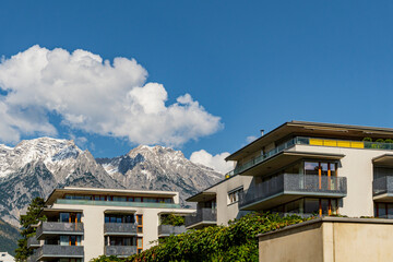 Modern Residential Apartments with Mountain View and Blue Sky in Sunny Weather