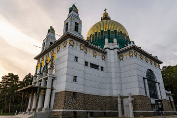 Majestic Historic Church with Golden Dome and Ornate Architecture under Cloudy Sky