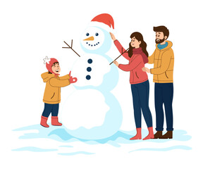 A family wearing warm winter clothes is making a large snowman with a Santa hat.