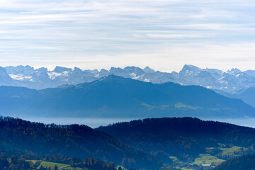 Aerial view of beautiful Swiss autumn landscape with Swiss Alps seen from local mountain Uetliberg...