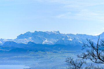 Aerial view of beautiful Swiss autumn landscape with Swiss Alps seen from local mountain Uetliberg on a sunny autumn day. Photo taken October 29th, 2025, Zurich Uetliberg, Switzerland.