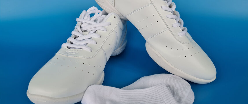 White Dance Shoes and Socks on a Blue Background - Powered by Adobe
