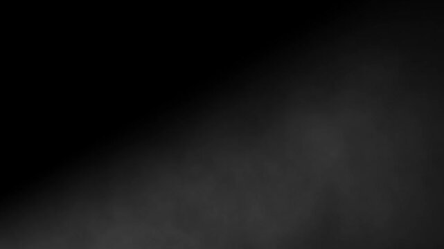 Slow motion abstract smoke or fog moving diagonally from left to right on a dark black background. Ethereal atmospheric vapor texture overlay element for visual effects, transitions, and moody scenes.