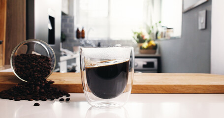 Coffee, glass and morning in kitchen for beans, drink or roast in home. Organic brew, strong caffeine and blend with countertop for mocha, espresso or liquid beverage in house for preparation