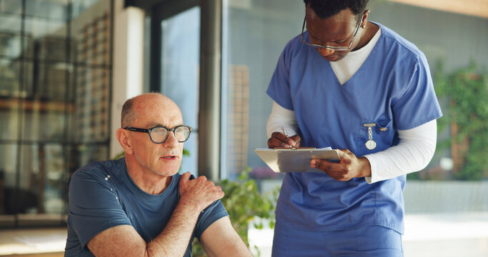 Nurse, clipboard and shoulder pain with mature man in clinic for physiotherapy, healthcare or symptoms. Support, retirement and chiropractor with senior person, exam and report for healing advice - Powered by Adobe