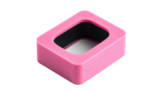 A close-up shot on a black background of a small, rectangular object with a pink exterior and a black and white interior