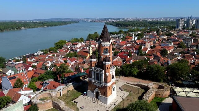 Aerial drone view of Gardos Tower in Zemun, Belgrade, Serbia historic brick landmark overlooking the Danube River, surrounded by red rooftops and old town architecture