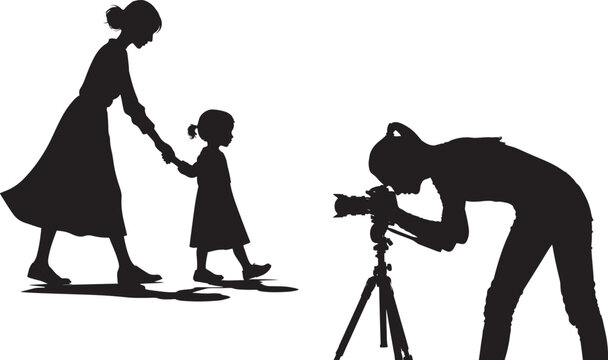 Silhouette of Photographer Capturing a Mother and Daughter Moment