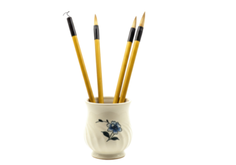 Isolated Chinese calligraphy brushes in vase, traditional art tools, asian handwriting practice