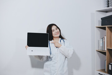 Female druggist standing with a digital tablet