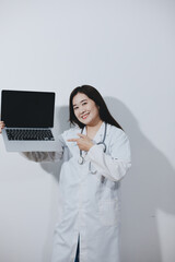 Female druggist standing with a digital tablet