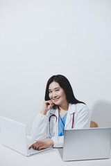 Receptionist working at the hospital registering patients