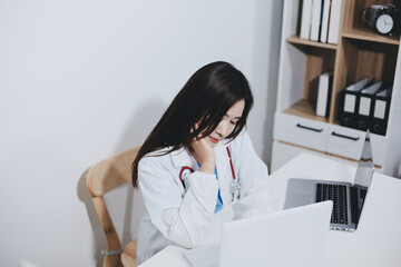 Receptionist working at the hospital registering patients