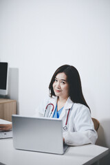 Receptionist working at the hospital registering patients