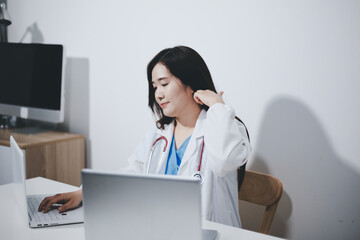 Receptionist working at the hospital registering patients