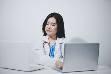 Receptionist working at the hospital registering patients