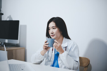 Female scientist holding coffee mug in laboratory