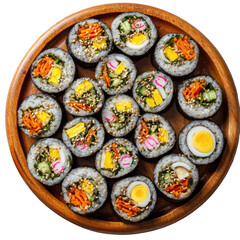 Kimbap assortment on wooden platter, colorful fillings visible inside