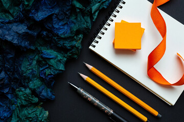 Workspace Flat Lay with Notebook Pencils Pen and Vibrant Blue Paper for Creative Projects and Planning Sessions