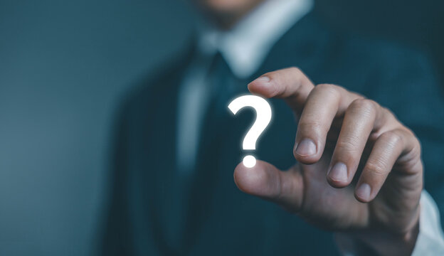 question mark shows on a laptop. concept of ask, answer, Business FAQ, Thinking, and wondering. question tech Brainstorming and problem-solving