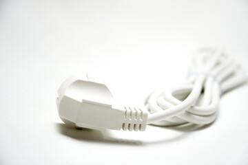 electric plug on white background. Close-up of white Electrical Cables with Exposed Copper Wires on White Background. Electric cables plug used to instalation in commercial and industrial Electrical S