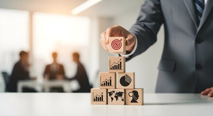 Business Strategy Achieving Goals with a Pyramid of Wooden Blocks Depicting Charts