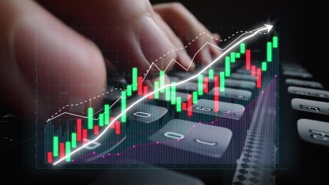 A close-up view of a hand on a keyboard as financial graphs and market data illuminate the background, showcasing digital trading strategies and economic analysis. Copula - Powered by Adobe