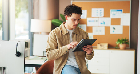 Review, social media management and tablet with man in call center for online tech support. App, planning and research with business employee at work for analysis of engagement, feed or impressions