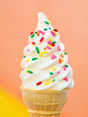 Delicious Soft Serve Ice Cream Cone Topped with Colorful Sprinkles on a Bright Background