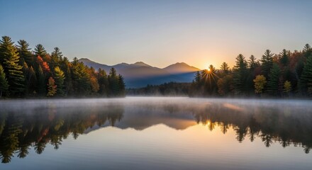 Picturesque lake reflection at sunrise with autumn foliage and distant mountain range creating a