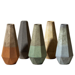 Group of five matte geometric vases in earth tones, close together