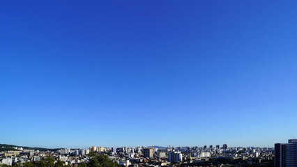 Sunny day in Seoul showcasing residential apartment blocks and sprawling urban landscape