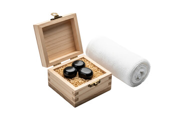 Wooden box with stones and towel on transparent background