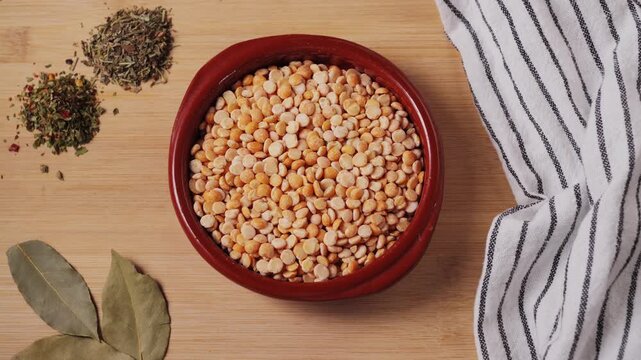 Dried yellow peas with spices close up. Healthy food concept. Healthy nutrition, vegan food. Garnish concept. High quality 4k footage