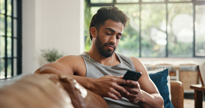 Relax, reading and man with phone on couch, check social media or browsing internet for digital book. Email notification, texting or person chilling in home with mobile app, blog post or watch video